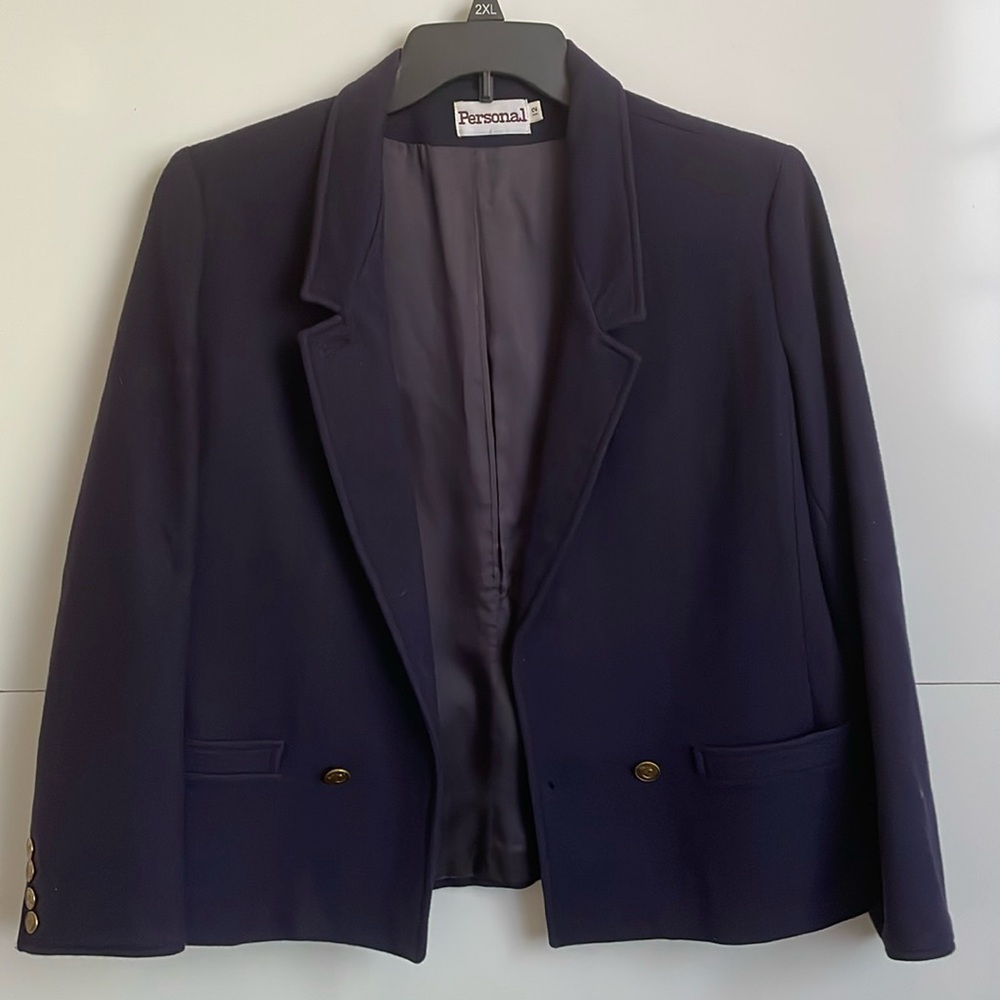 This navy blue women's wool blazer from the trusted brand Personal. Size 12.
